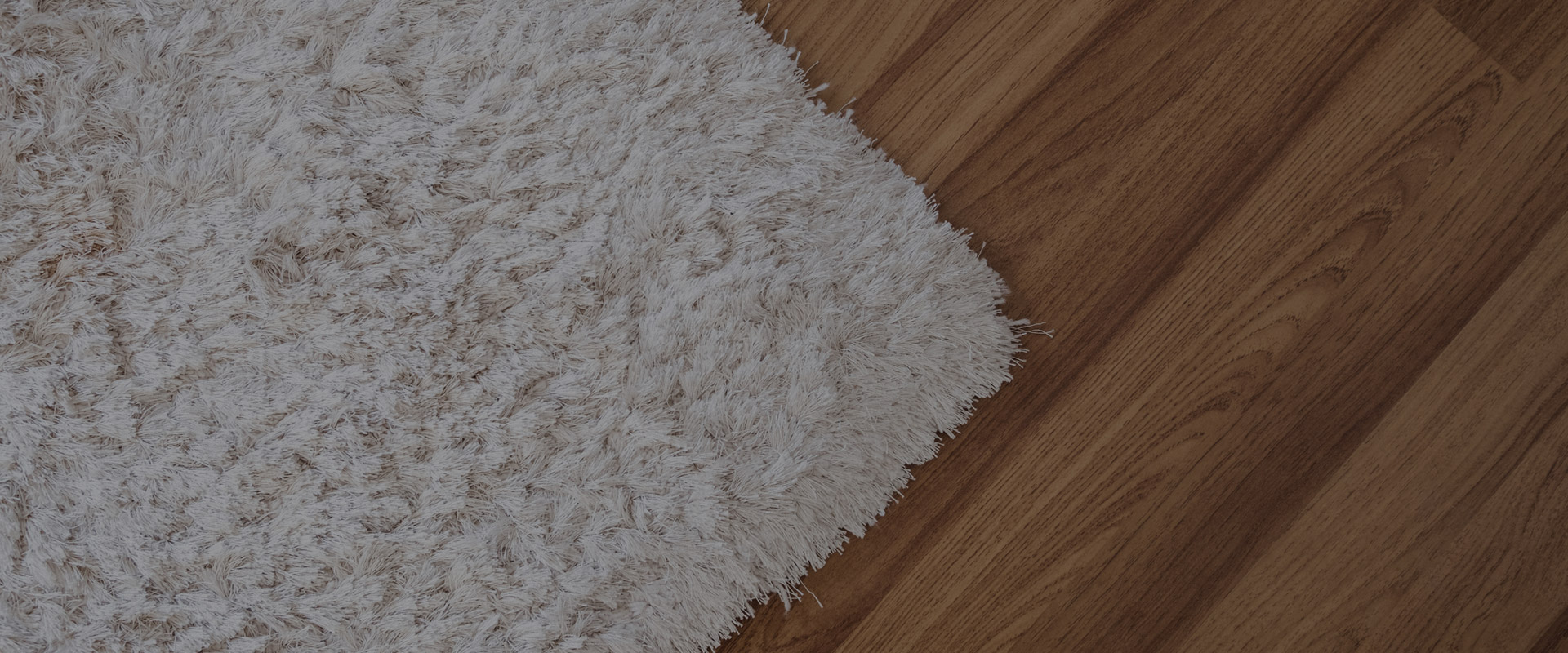 wooden floor with shag rug
